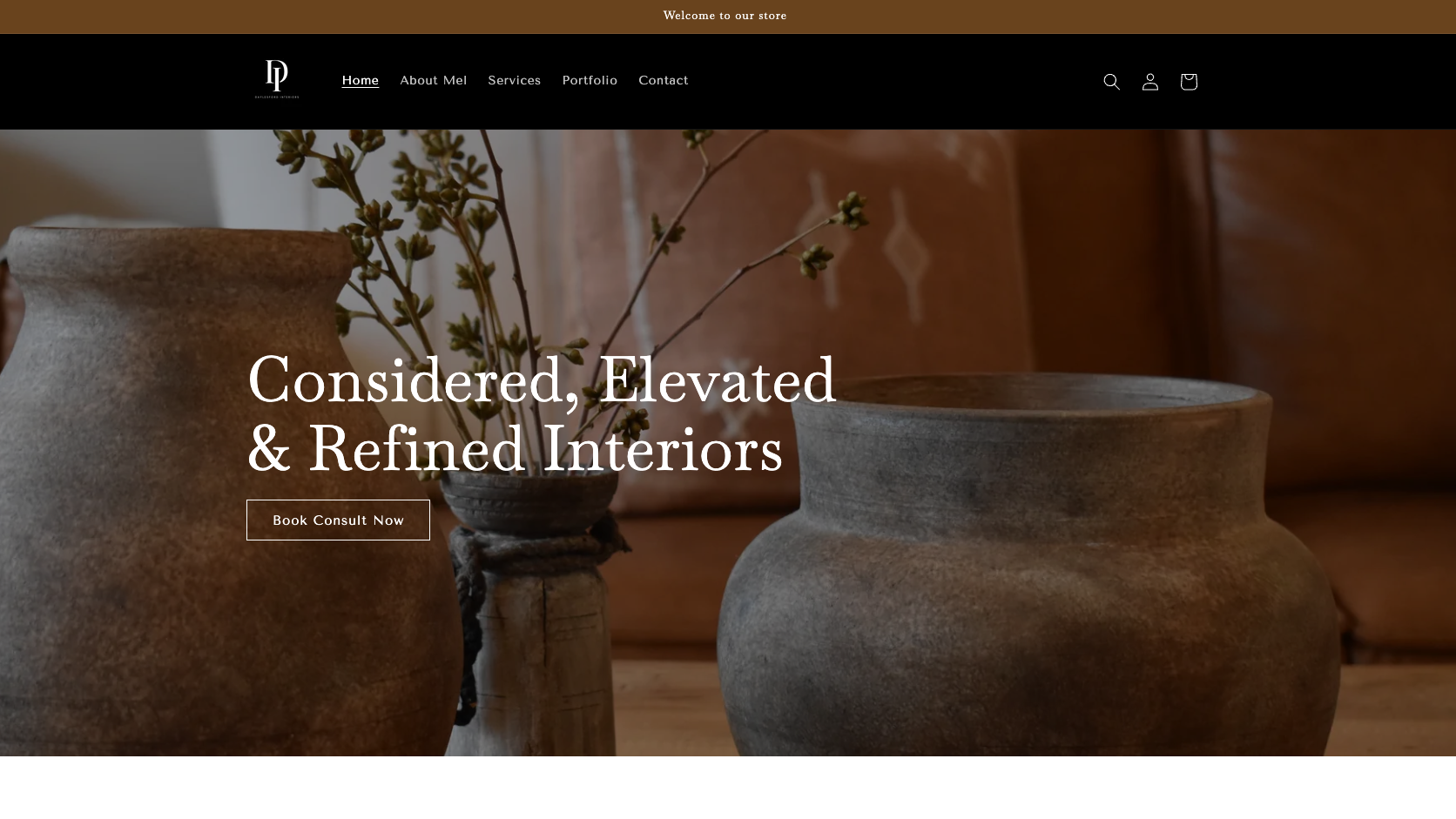 Website homepage with decorative vases and text about interior design.