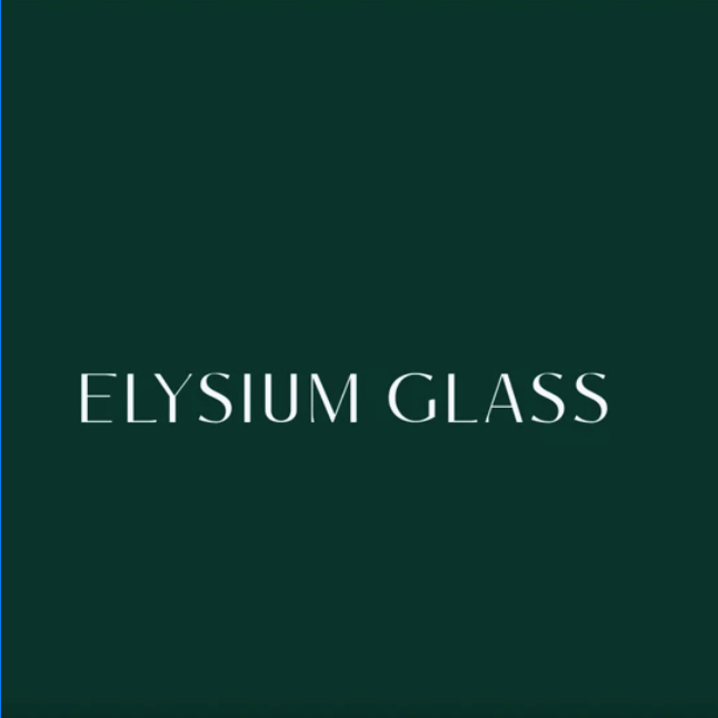 Elysium Glass branding panel next to a modern living room interior with floor-to-ceiling glass windows, black frames, a brown leather armchair, a gray sofa, and a poolside outdoor view.