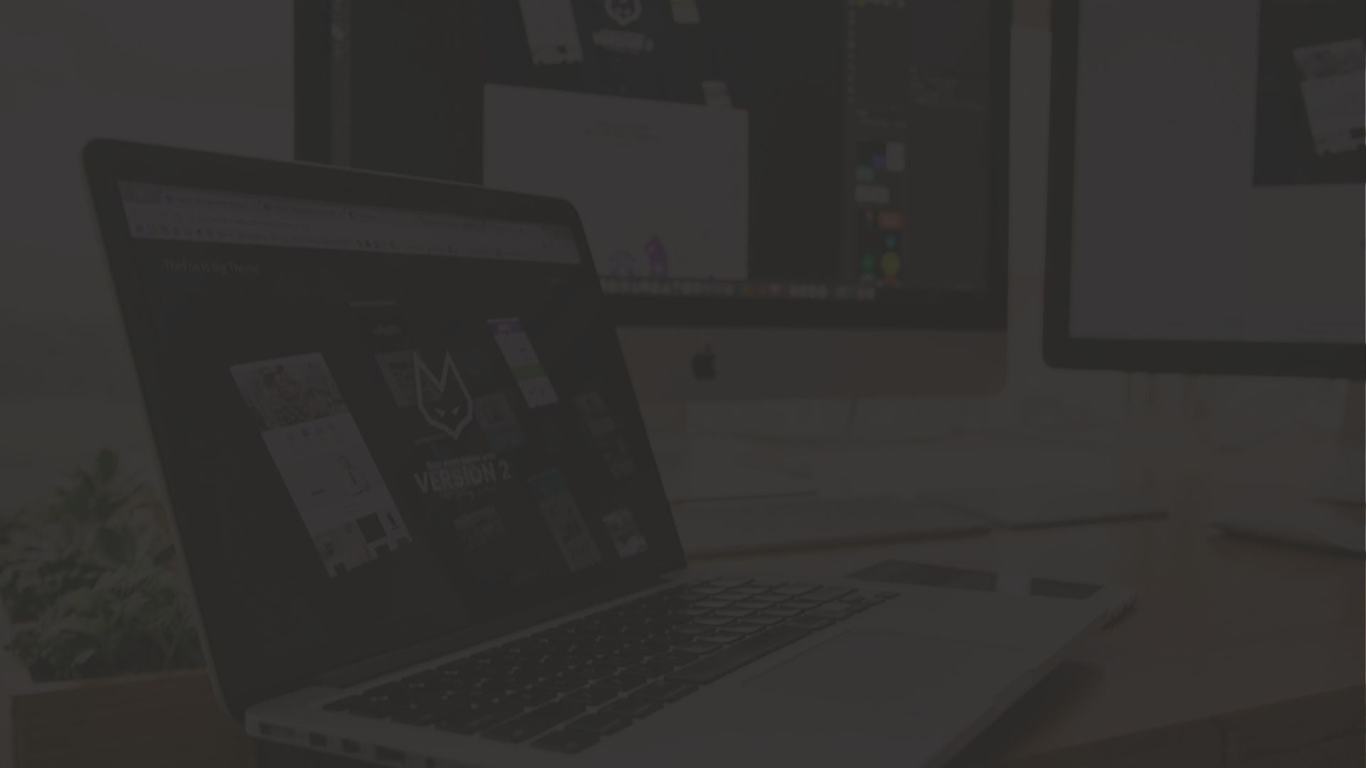 Laptop with a logo on the screen in an office setting